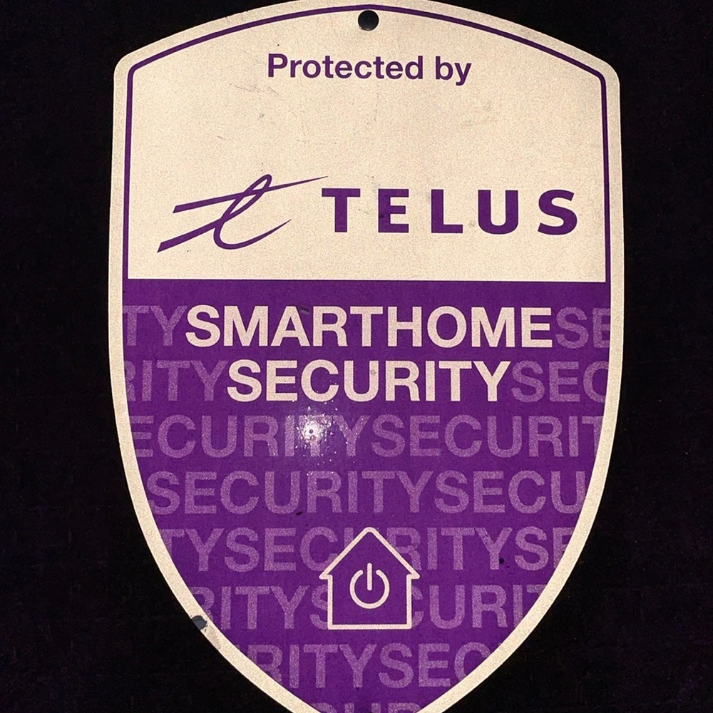 Protected by Telus Smart Home Security outdoor Sign from alarm.com system adt